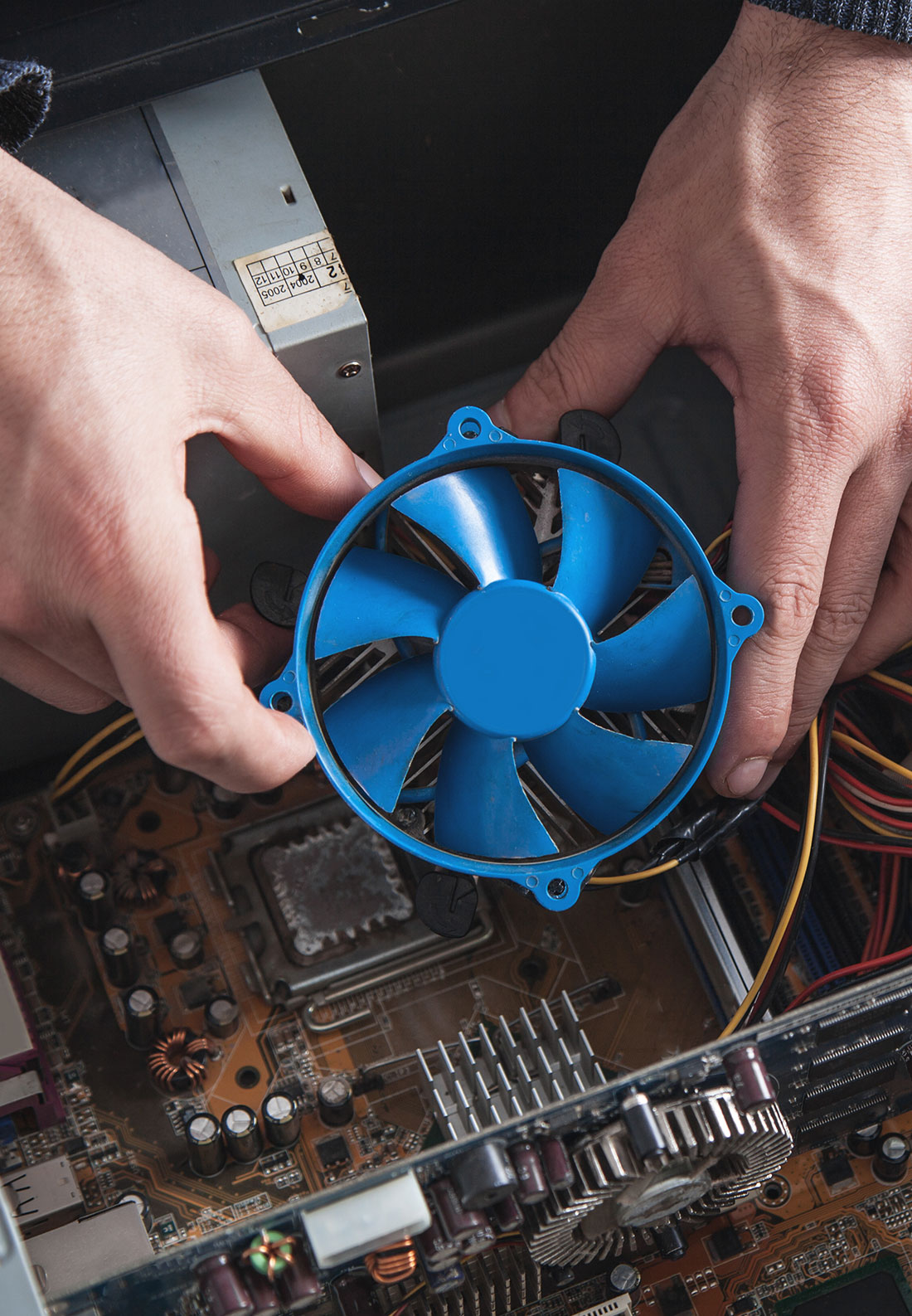 Man Repairing Cooling System